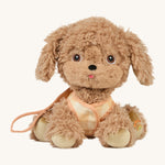 The Olli Ella Dinkum Dog - Goldie is sat down like a good dog, and is wearing their harness