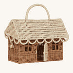 The Olli Ella Gingerbread House basket, with the door open. The image is taken side on to give a view of the wooden bead tie to keep the lid and the door closed. The image is on a cream background