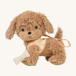 Olli Ella Dinkum Dog - Goldie. A lovely soft plush dog in light brown with brown eyes. This Dinkum Dog come with a coral and peach harness and a plush toy bone.