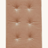 A soft, velvet Olli Ella Strolley mattress perfect for keeping any doll comfy in a Strolley. This mattress is in Champagne colour and is on a cream background