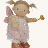 A side image of the Olli Ella Willow dream dinkum doll available at Babipur.showing the white glittery dress detail
