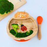 Eco Rascals Ladybird Bamboo Suction Plate with an orange silicone base and baby spoon, with broccoli and carrot puree. 