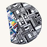 Etta Loves x Camille Walala Reversible Playmat. One side is in a monochromatic shape design, the other is in a colourful shape design
