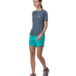 A person wearing the Patagonia Women's Capilene Cool Trail Graphic Shirt