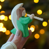 Ostheimer Wooden Green Angel playing the flute - a rocking toy or decoration figure, perfect for Christmas or a nativity scene - for sale at Babipur.