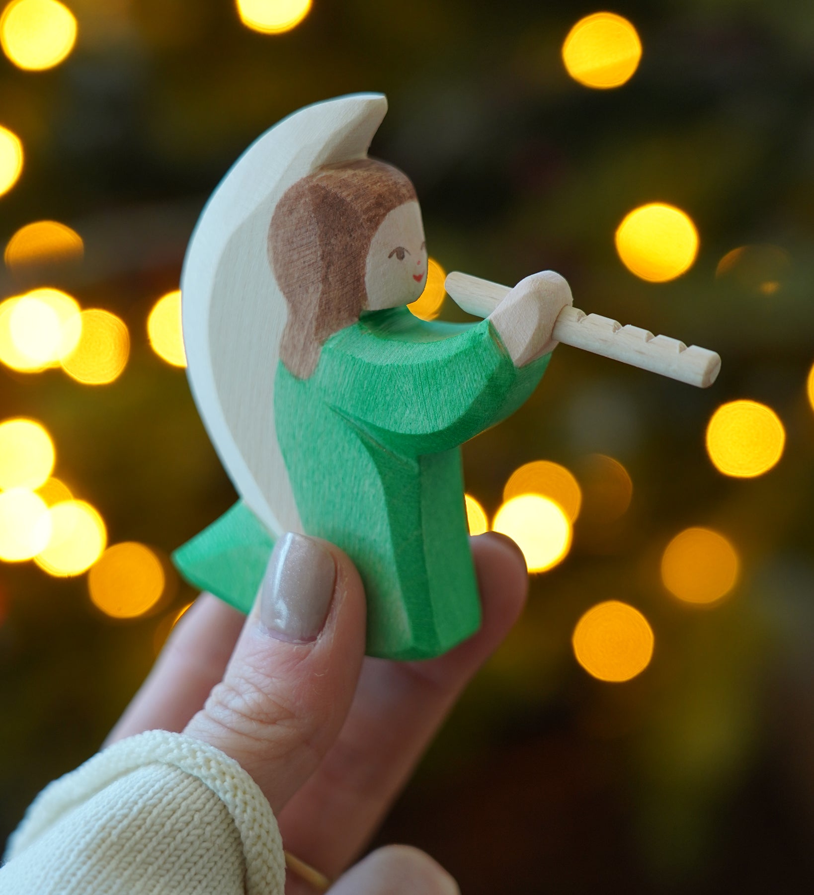 Ostheimer Wooden Green Angel playing the flute - a rocking toy or decoration figure, perfect for Christmas or a nativity scene - for sale at Babipur.