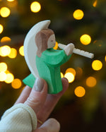 Ostheimer Wooden Green Angel playing the flute - a rocking toy or decoration figure, perfect for Christmas or a nativity scene - for sale at Babipur.