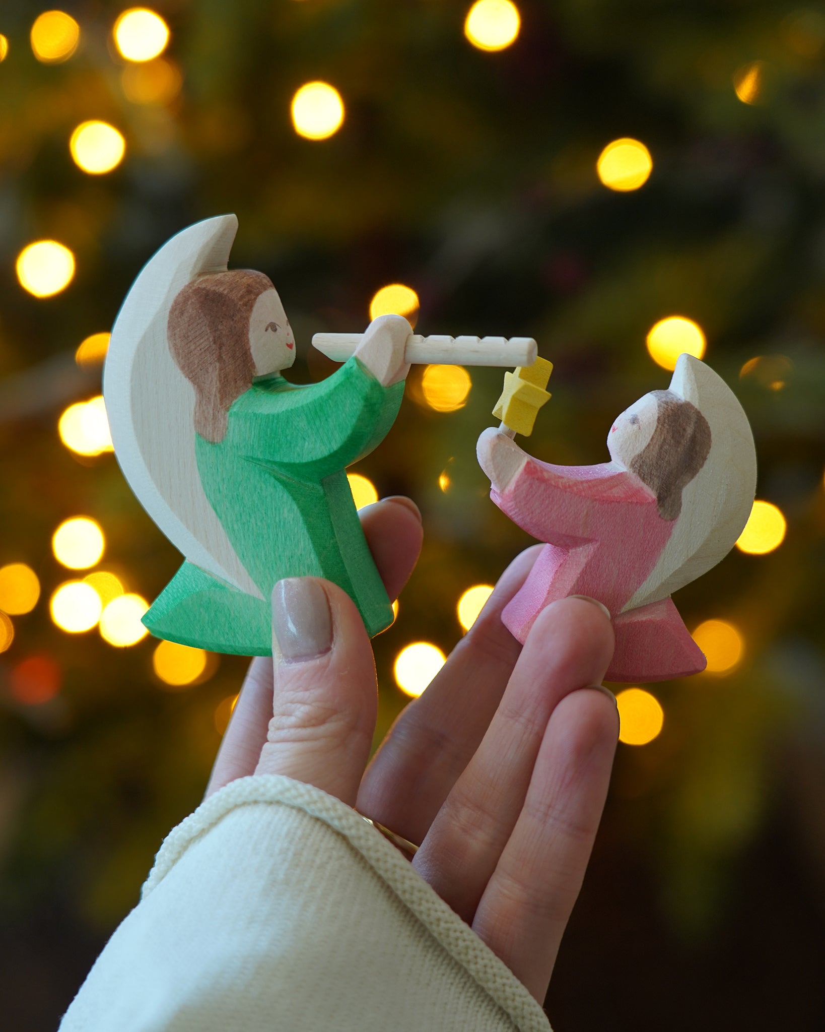 Ostheimer Angels, green with flue and pink with star - wooden rocking angel toy figures, available to buy at Babipur.