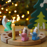 Pair of Ostheimer wooden angels with stars in blue and pink, for Christmas or nativity play or displays, on a Grimm's celebration ring, for sale at Babipur.