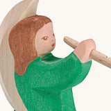 A close up of the Ostheimer wooden angel figure playing a flute, available at Babipur showing the hand painted detail