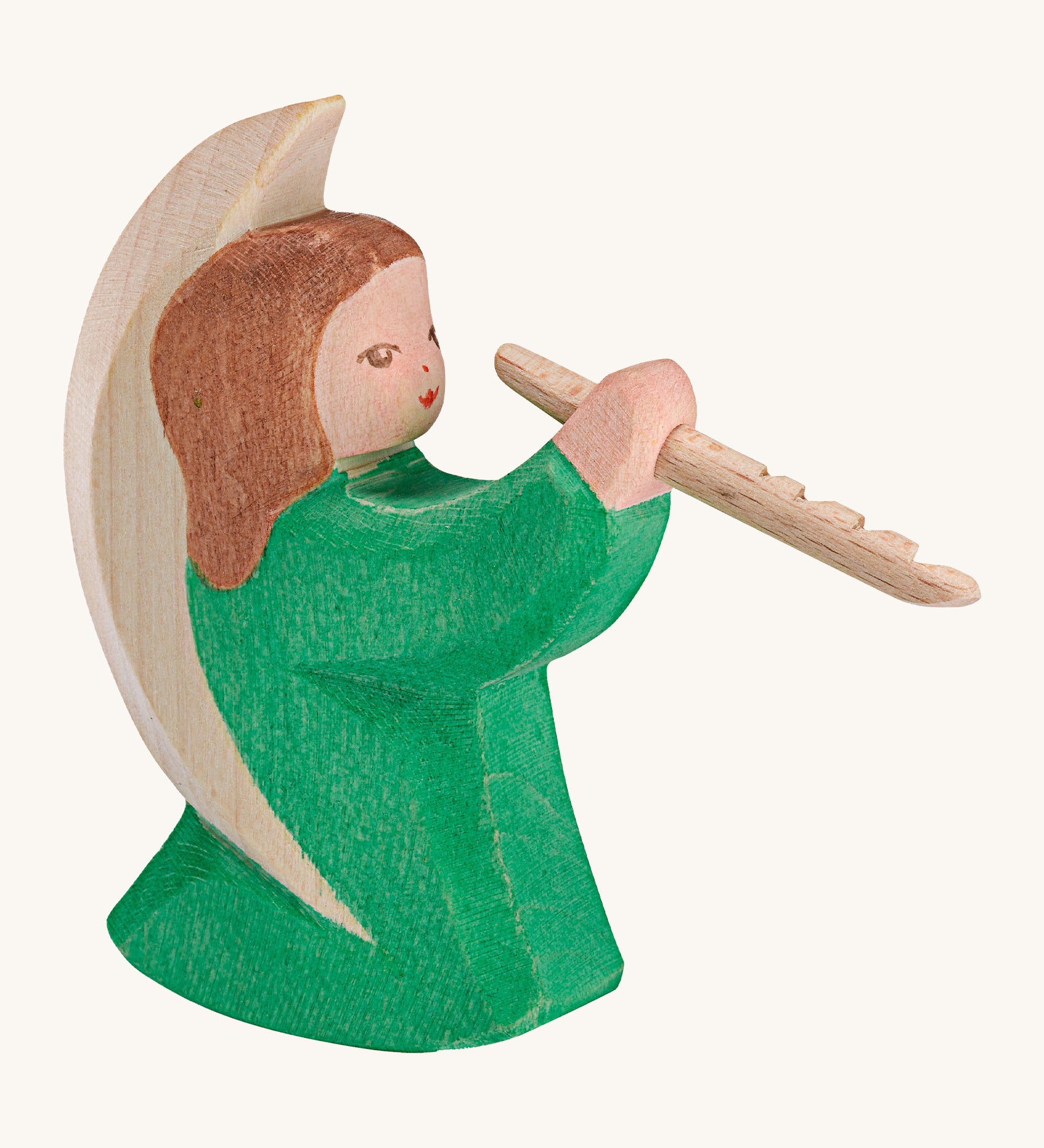 A Ostheimer wooden angel figure playing a flute, available at Babipur. This handmade and hand painted festive figure has a green dress and brown hair.