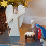 Ostheimer Wooden Angel With Star in a Nativity scene - use as a decoration or Christmas toy - for sale at Babipur