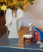 Ostheimer Wooden Angel With Star in a Nativity scene - use as a decoration or Christmas toy - for sale at Babipur