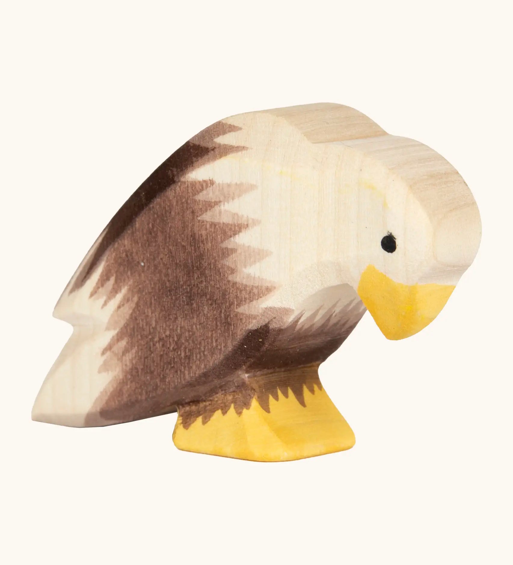 Ostheimer handcrafted wooden sitting bald eagle figure with hand painted brown body and unpainted head.