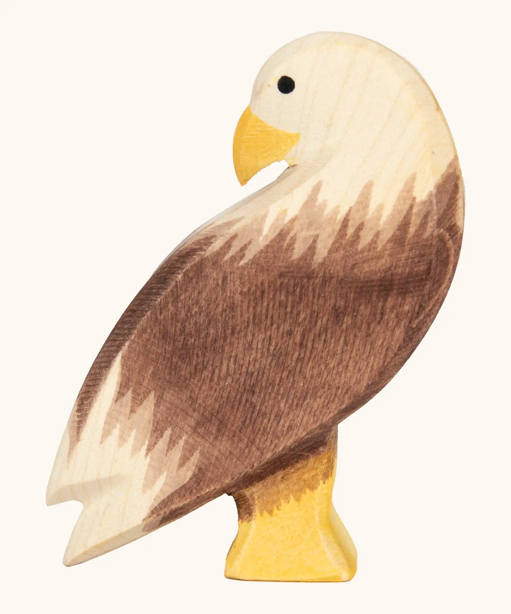 Ostheimer handcrafted wooden standing bald eagle figure with hand painted brown body and unpainted head.