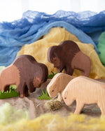 Ostheimer wooden toy Bison family in small world play scene using Ostheimer scarves and grass.