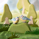 Ostheimer blue tits, wooden bird toys in small world play scene using Ostheimer trees, scarves and grass.