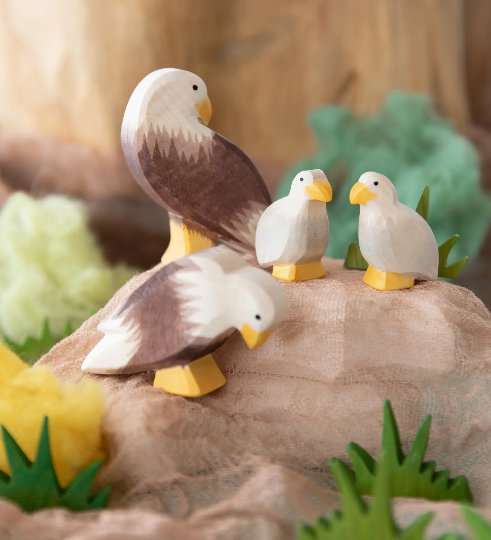Ostheimer bald eagle family. Wooden toys in small world play scene using Ostheimer scarves and grass.