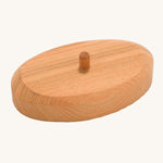 The wooden support stand for the palm tee, in natural wood with a dowel in the middle. The image shows the natural wood grain of the stand