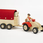 An Ostheimer toy farmer on an Ostheimer tractor, transporting 2 Ostheimer horses in the horsebox
