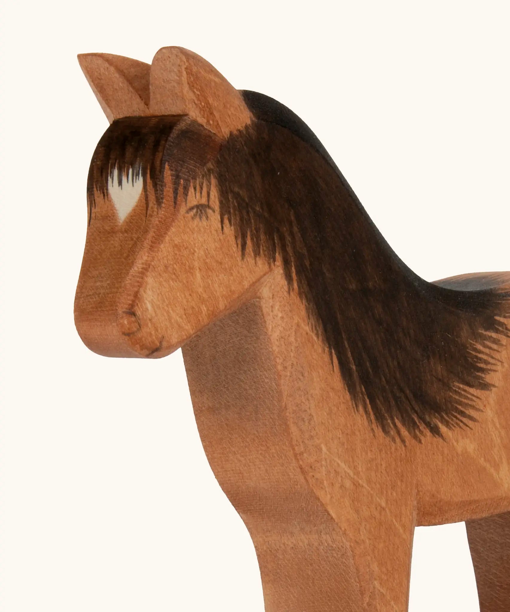 Hand painted facial features and hair on the Ostheimer wooden Hrokur the horse  figure