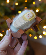 Ostheimer wooden baby Jesus in crib figure - nativity toy or Christmas decoration - buy now at Babipur.