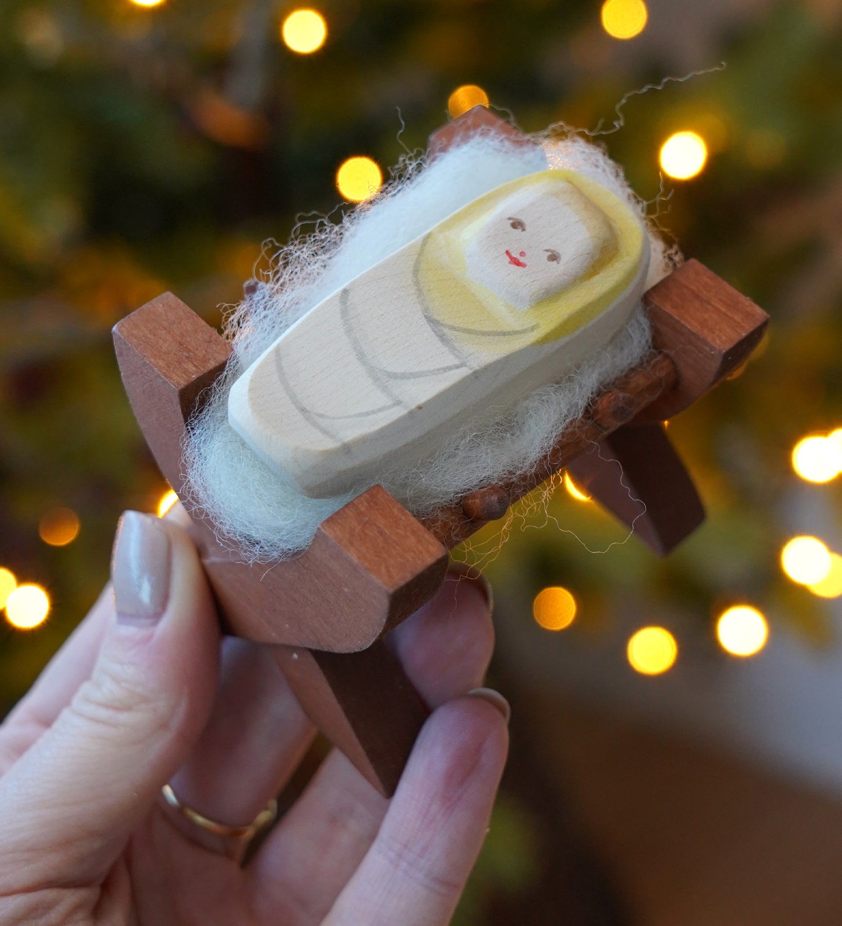 Ostheimer wooden baby Jesus in crib figure - nativity toy or Christmas decoration - buy now at Babipur.