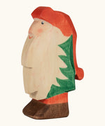 Ostheimer hand crafted Norbet winter gnome figure with hand painted green outfit red hat and unpainted beard