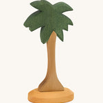 This palm tree has a slim natural wooden trunk and fronds stained dark green, with a light wooden base. Perfect for any beach or desert play scene