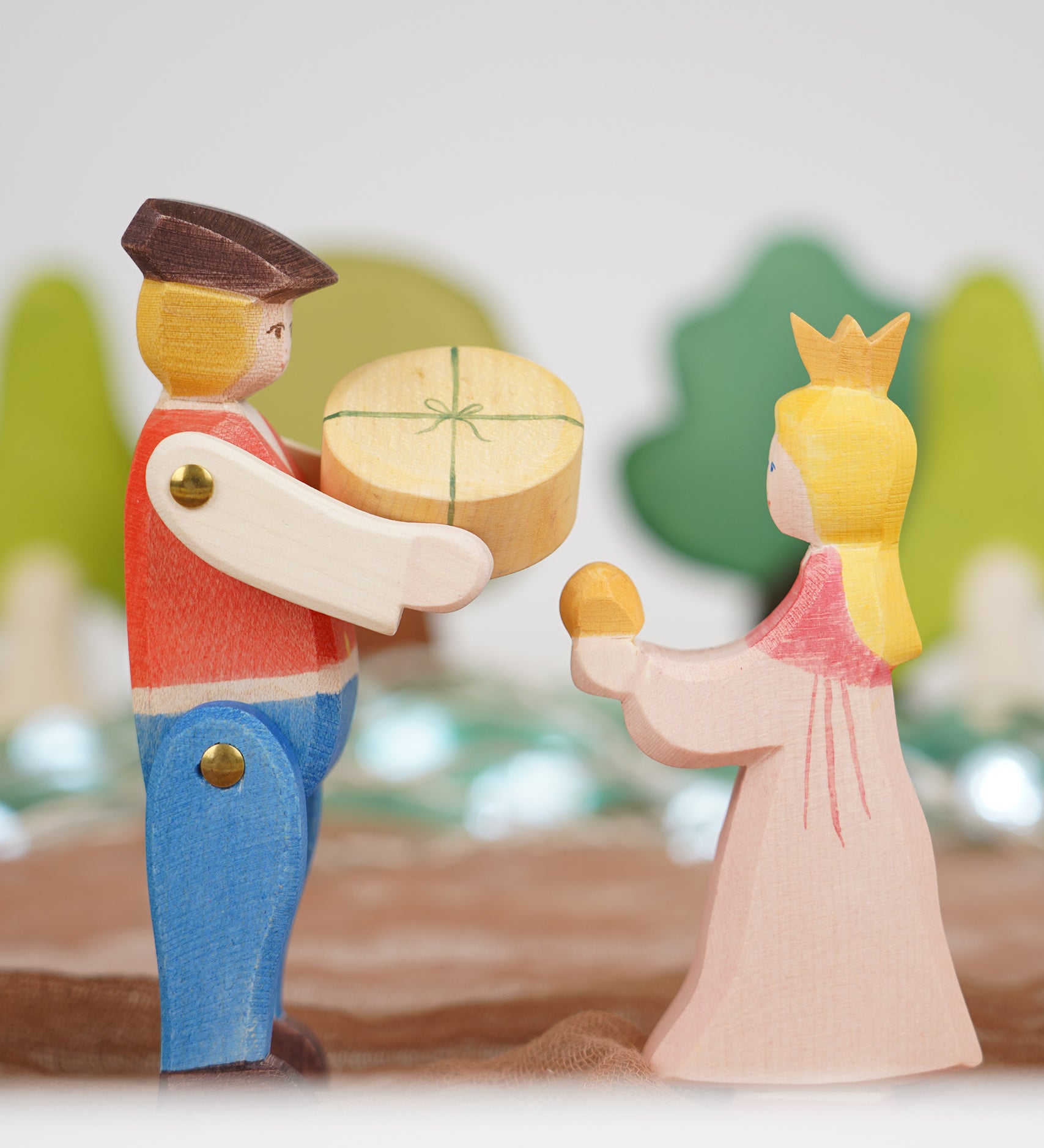 Ostheimer Rider and Princess wooden toy figures, handmade in Germany, exchanging a small round round, Waldorf and small world play scene, sold at Babipur