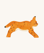 The Ostheimer Running lynx from the side, showing its dark brown spot detail