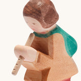 A close up of the Ostheimer wooden shepherd figure playing the flute available at Babipur showing the hand painted detail