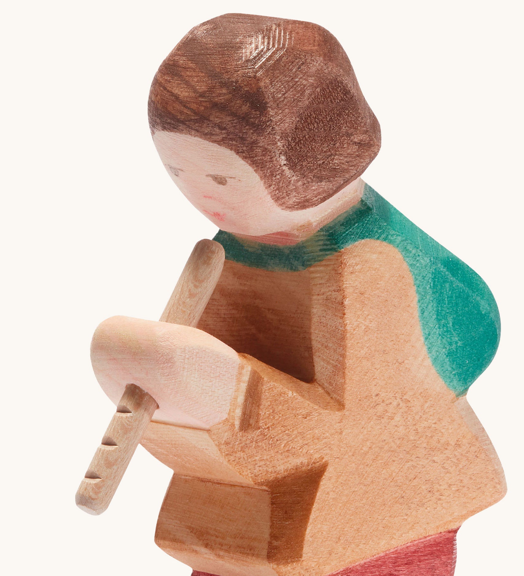 A close up of the Ostheimer wooden shepherd figure playing the flute available at Babipur showing the hand painted detail