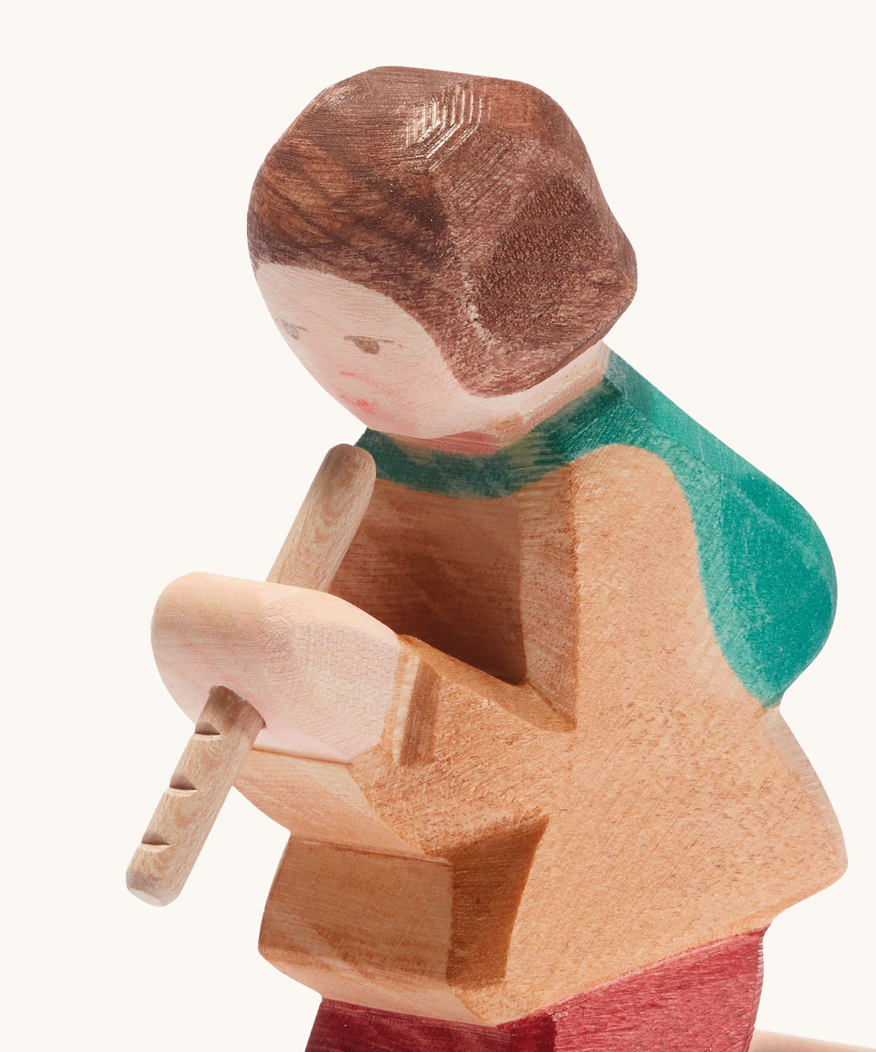 A close up of the Ostheimer wooden shepherd figure playing the flute available at Babipur showing the hand painted detail