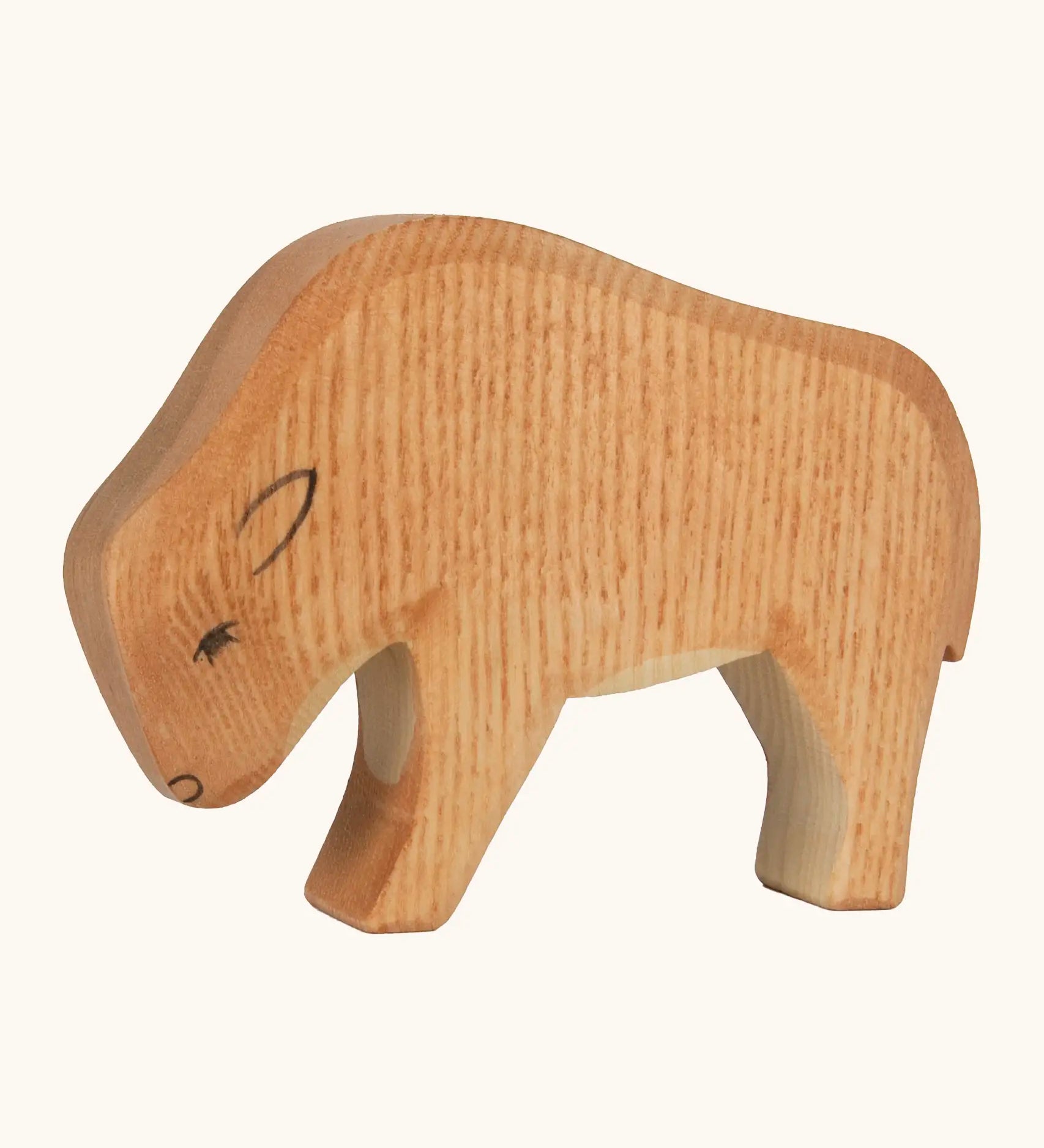 Ostheimer hand crafted wooden small bison figure with handpainted light brown body and black facial features