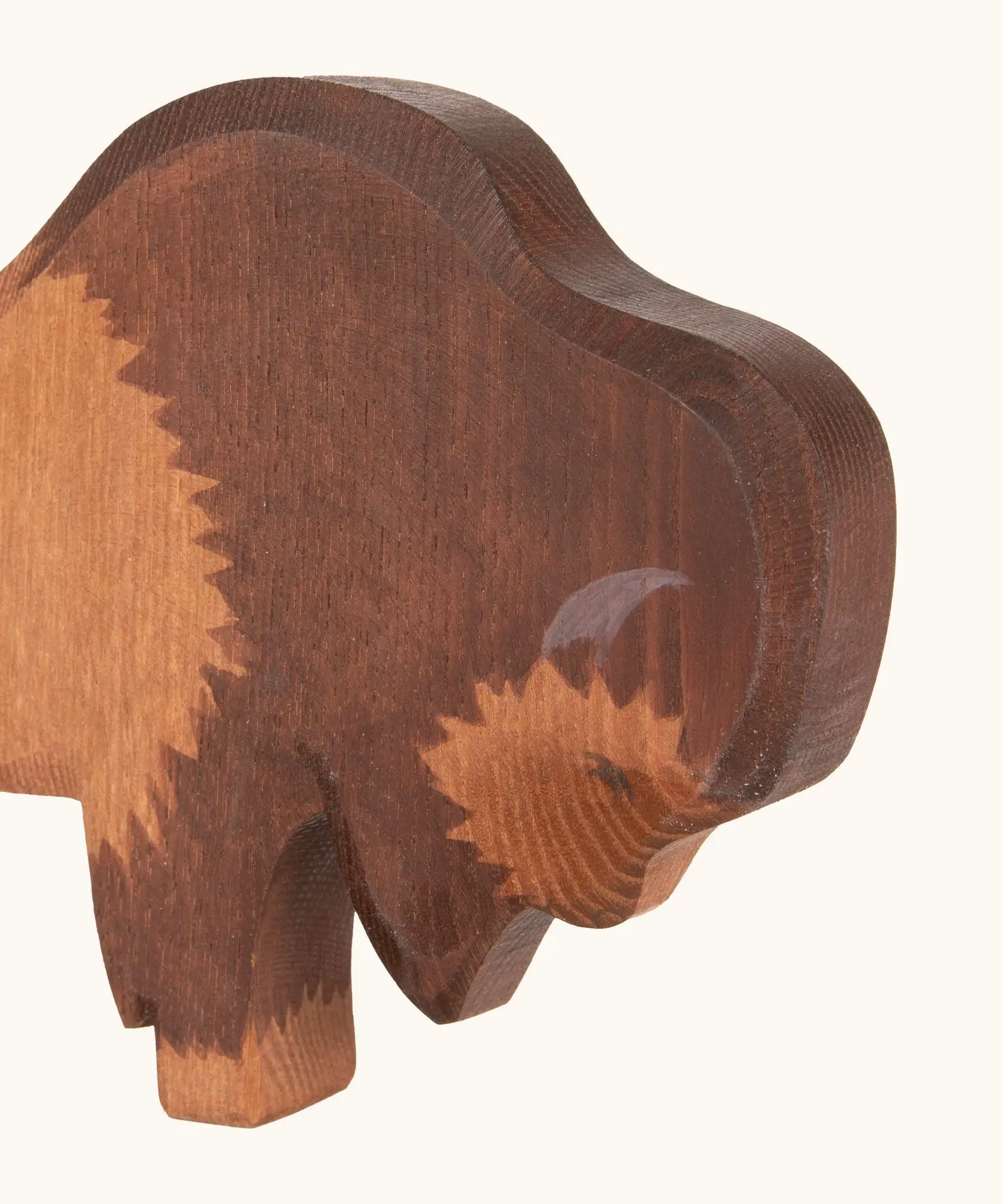 Hand painted facial features on the Ostheimer wooden bison figure
