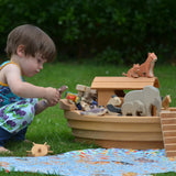Ostheimer wooden Noah’s Ark with hand-painted animals and figures, heirloom toy handmade in Germany, toddler playing in Waldorf-inspired playroom, ideal for small world storytelling and open-ended play, sold at Babipur