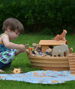Ostheimer wooden Noah’s Ark with hand-painted animals and figures, heirloom toy handmade in Germany, toddler playing in Waldorf-inspired playroom, ideal for small world storytelling and open-ended play, sold at Babipur