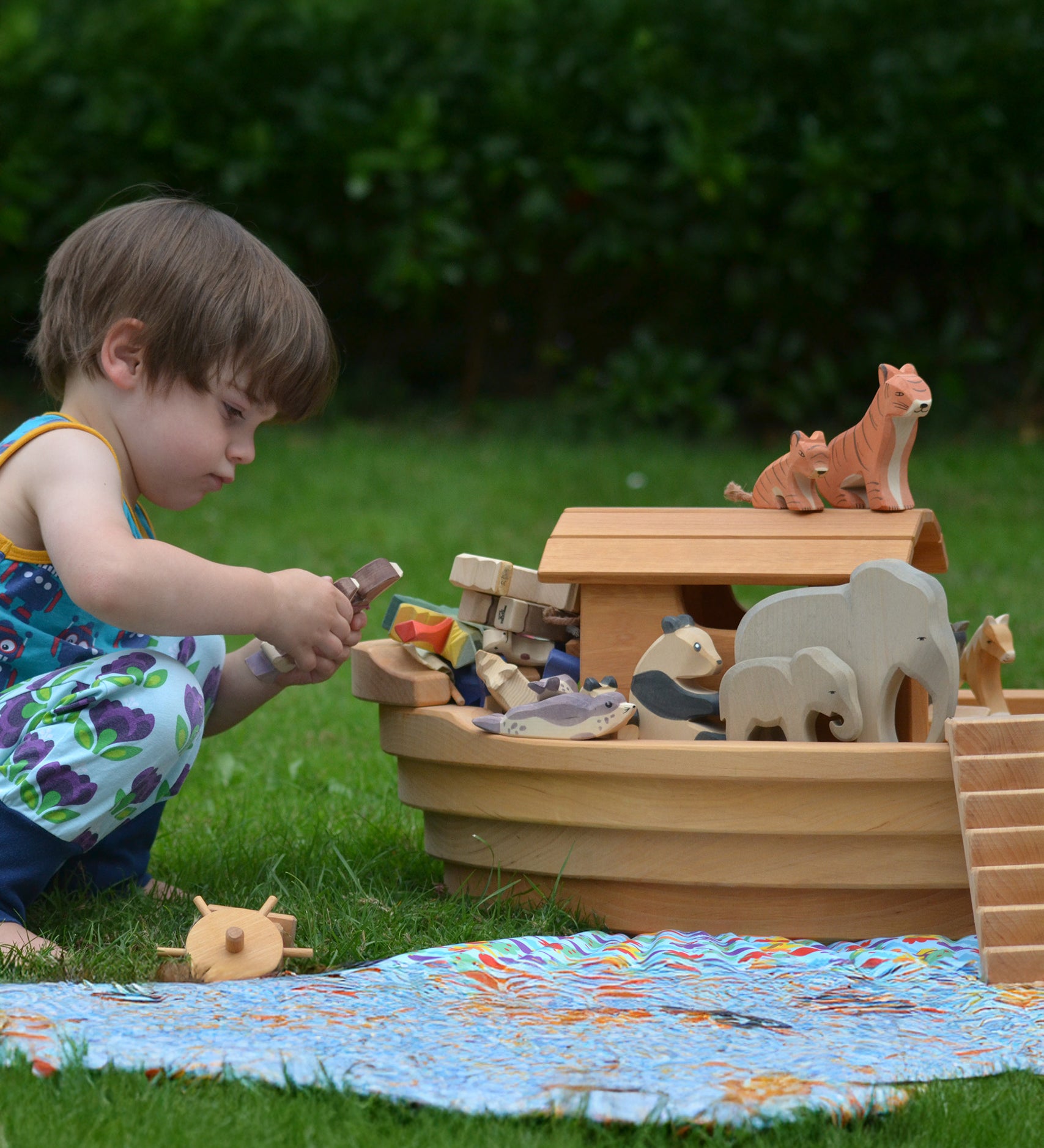 Ostheimer wooden Noah’s Ark with hand-painted animals and figures, heirloom toy handmade in Germany, toddler playing in Waldorf-inspired playroom, ideal for small world storytelling and open-ended play, sold at Babipur