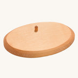 The natural wooden base support of the palm trees, with a wooden dowel towards the top of the base