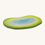Ostheimer eco-friendly handmade wooden pond toy scene on a white background. The pond goes from shades of green on the outside, to blue on the inside