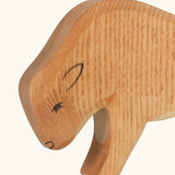 Hand painted facial features in black on the Ostheimer wooden small bison figure