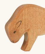 Hand painted facial features in black on the Ostheimer wooden small bison figure