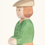 Hand painted facial features on the Ostheimer wooden young farmer figure