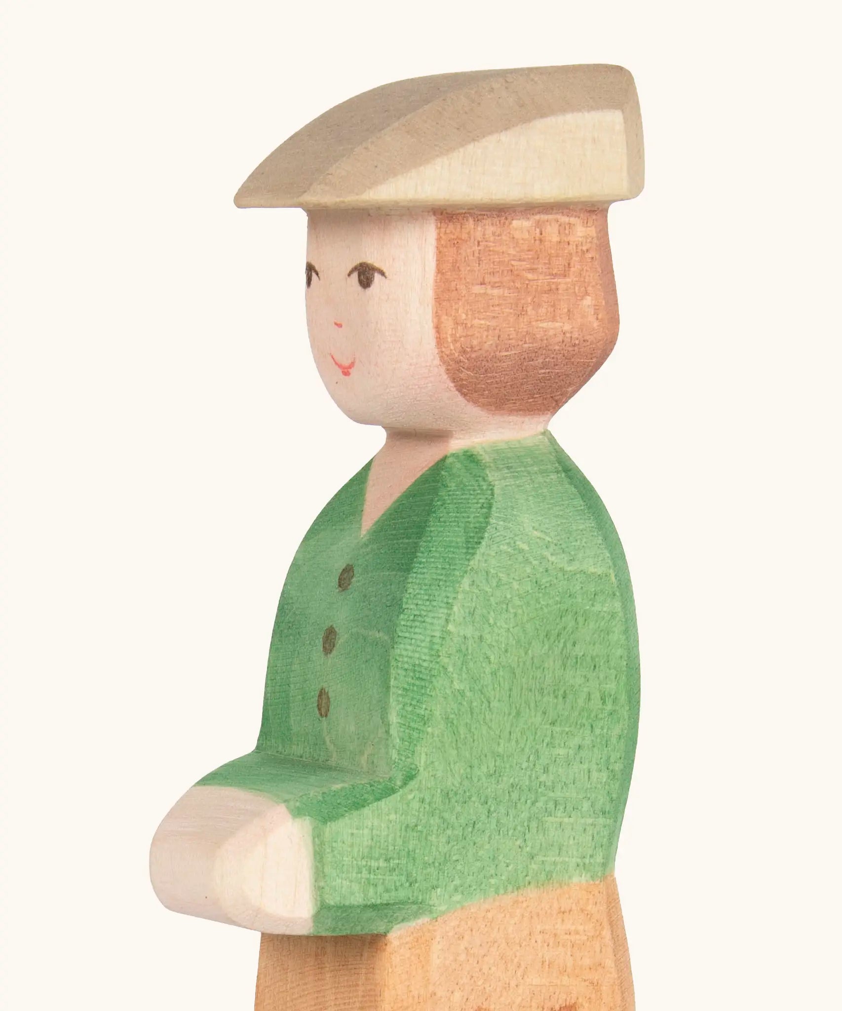 Hand painted facial features on the Ostheimer wooden young farmer figure