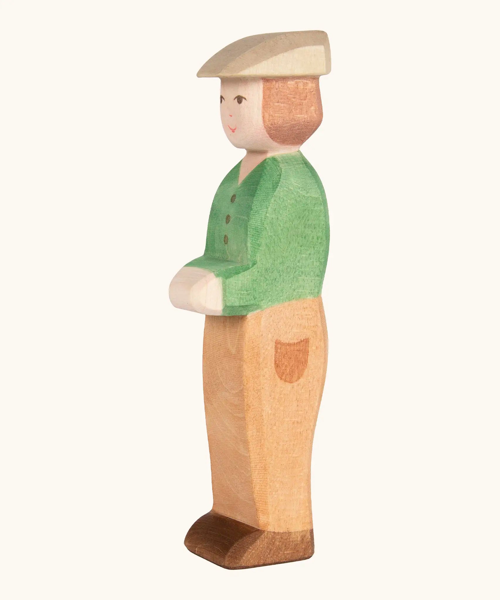 Ostheimer handcrafted wooden young farmer figure with hand painted green coat, brown trousers and flat cap