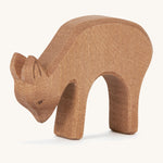 A wooden Ostheimer deer figure eating on a cream background