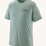 The Patagonia Men's Capilene Cool Merino Graphic T-Shirt in thermal blue, with a small logo on the left of the chest