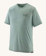 The Patagonia Men's Capilene Cool Merino Graphic T-Shirt in thermal blue, with a small logo on the left of the chest
