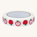 Babipur Eco Kraft Tape in white, with a fun apple repeat print. On a cream background